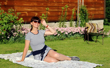 portrait of a woman sitting on the grass