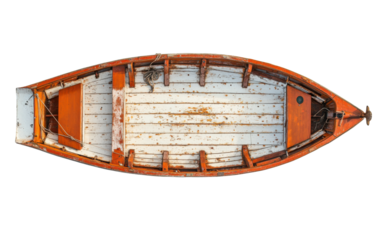 Weathered orange and white wooden boat seen from above