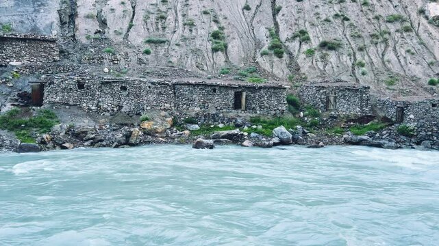 Old villages in Tajikistan. Tajikistan's road along the Zeravshan River near the Pamir highway. Old stone villages in the mountains of the Silk Road. 4К