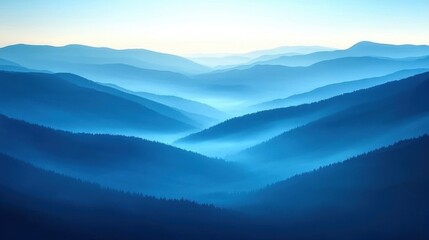Obraz premium Rolling Mountain Range with Foggy Blue Mist in Early Morning