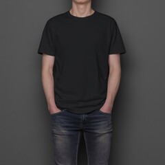 Obraz premium A man wearing a black t-shirt and jeans standing with his hands in his pockets