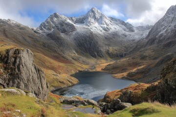 Serene Mountainous Valley with Lake and Clouds