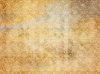 Aged grunge paper background with old-fashioned ornament.