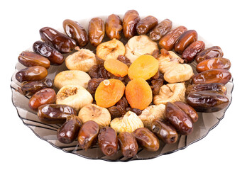 Assorted dried fruits on a glass plate isolated on transparent background