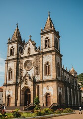 Fototapeta premium Sunlit Portuguese-Style Church: Azulejo Facade and Architectural Detail
