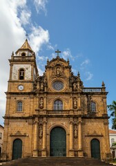 Fototapeta premium Baroque Church Facade: Sunlit Stone and Intricate Detail
