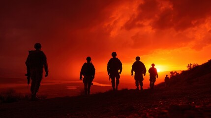 Fototapeta premium Silhouette of Soldiers Walking Uphill Against a Fiery Sunset Sky Depicting Military Service Duty and Remembrance Honoring Veterans and Sacrifice : Generative AI