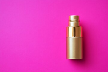 Gold bottle on vibrant pink background