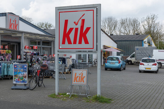 A Kik discount store entrance with its red and white logo on signs, showcasing budget-friendly clothing and household items. Kleve, Germany. 22 April 2025.