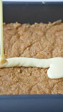 Step by Step video of baked Easter inspired sweet crunch bars made with digestive biscuits, buttered crushed corn flakes, condensed milk, chocolate and Easter mini eggs