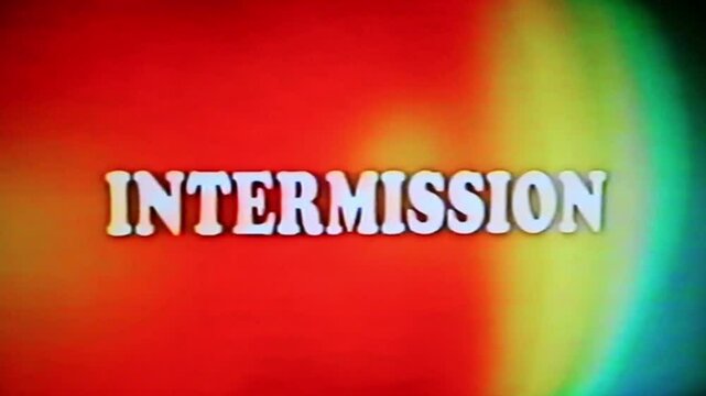 Intermission text in vintage, retro film or videotape era font and color style. Processed through videotape for authentic analog tape damage effect.