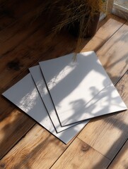 Stacked Papers Sunlight Shadow Wooden Floor Mockup