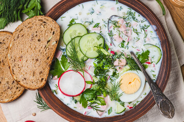 Okroshka on kefir with radishes and herbs