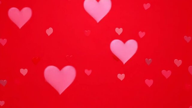 Cute romantic red background with animated pink and red hearts. Hearts fly out from the centre and diverge to the edge. Festive animation for Valentine's Day, Women's Day, Mother's Day. 4k