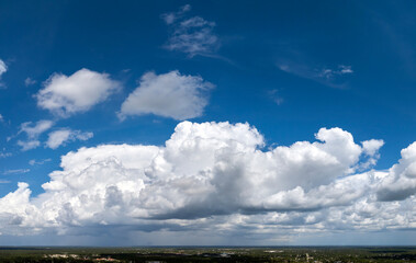 Rain clouds forming on blue Florida sky. Colorful summer skyscape