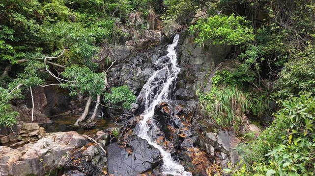 May 10 2025  Siu Chik Sha Waterfall Cascading in Forest Landscape