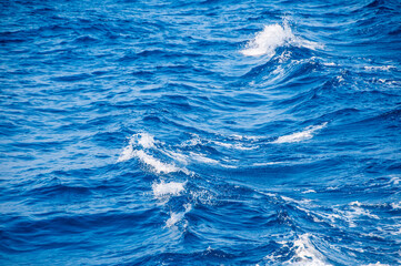 Naklejka premium dark ocean water. sea ​​water pattern, natural composition of ripples on the water. texture of foam in water