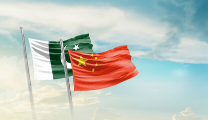 China and Pakistan flags are waving in the sky. Two country flag for agreement or deal. China China national flag for commitment.