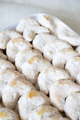 Kue Nastar and Putri Salju (Pineapple Tart and Snow-White Cookie) in a white box and background. Famous delicacy for Lebaran (Eid al-Fitr), Natal (Christmas), and Imlek (Chinese New Year) in Indonesia
