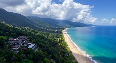Obraz premium Panoramic landscape showing high mountain villa, thin forest descending into coastal sand beach, birds-eye view, cloudy skies