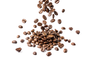 A pile of coffee beans with more beans falling onto it on a black isolated background studio shot