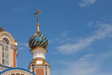 The multi-colored dome of the Church of the Icon of the Mother of God Sporitelnitsa in the city of Orel, Russia