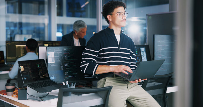 Coding, man and thinking with laptop in office for debugging solution, software update or app development deadline. Night, coder or technology for website troubleshooting, problem solving or overtime