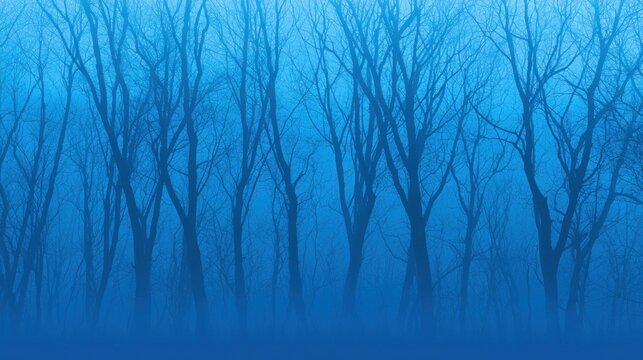 A forest of bare trees in a foggy blue landscape.
