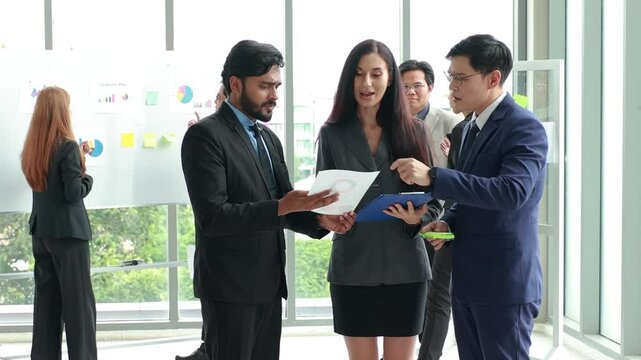 Brainstorm Mindmapping :  Diverse Professionals Brainstorming on Glass Wall with Sticky Notes.  Asian indian man. Shows Graphs, Infographics, AI, Big Data, Mindmapping. Glass Board and  Marker