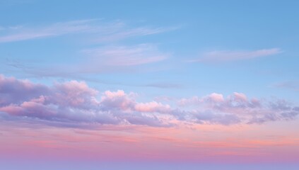 Fototapeta premium Serene pastel sunset sky with soft clouds.
