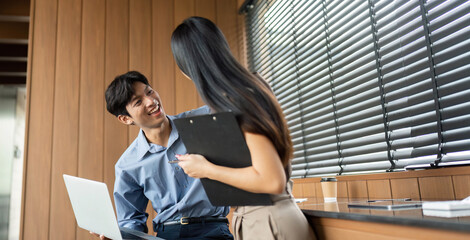 Business Communication and Strategy. Engaged professionals sharing insights in a collaborative office environment.