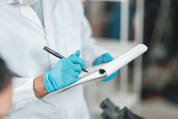 Medical research team conducting health and pharmaceutical experiments using blood samples in laboratory to develop advanced treatments and vaccines for global healthcare innovation