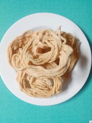 kerupuk mie bulat or round noodle crackers. Medan crackers. round noodle crackers are crackers made from tapioca flour dough with a round shape resembling noodles. fried. dry and crispy snacks.