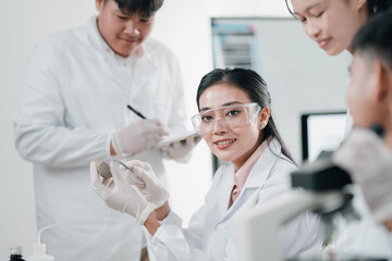 Geological researcher classifying rock and mineral samples in laboratory setting, focusing on earth...
