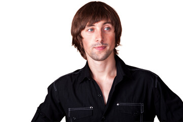 Confident young man posing in stylish outfit with a relaxed expression