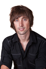 Obraz premium Young man with stylish haircut posing against a simple background