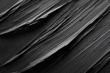 Abstract black paint texture with dynamic brush strokes creating a sense of movement. suitable for backgrounds in artistic or modern design projects