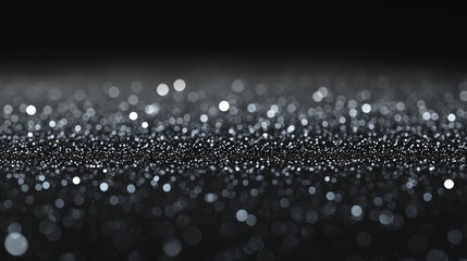 A mesmerizing close-up of shimmering particles scattered across a dark surface. creating a magical atmosphere with soft bokeh lights in the background. ideal for festive or celebratory themes