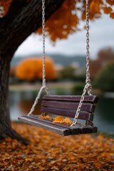 A swing hanging from a tree in a park with greenery and leaves.
