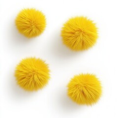 Obraz premium Yellow fluffy balls arranged neatly on a white background highlighting soft textures and vibrant colors in a minimalist display