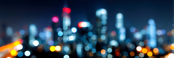 City skyline illuminated at night with a blurred perspective of lights and buildings