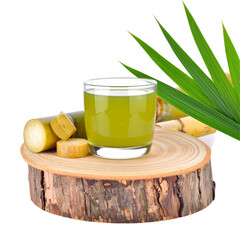 Fresh sugarcane juice in glass on wooden slice