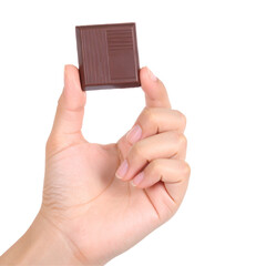 Hand holding a square object against a black background showcasing texture and shape with clear lighting for commercial or editorial use