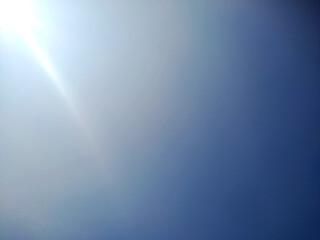 Sunlit Sky: A Serene Blue Canvas of Nature's Beauty