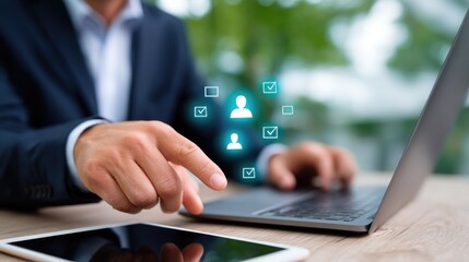 A businessman interacts with a laptop, using digital tools for communication and networking.