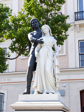 Statue of Eca de Queiros with female in Lisbon, Portugal.