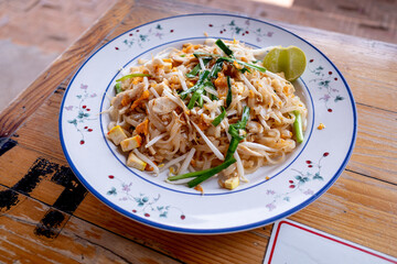 A plate of delicious phad thai or stir-fried rice noodle which is the most popular dish in Thailand