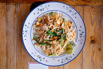 A plate of delicious phad thai or stir-fried rice noodle which is the most popular dish in Thailand