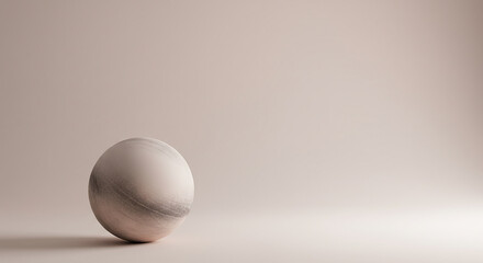 Minimalist composition with a marble sphere against a neutral background providing copy space