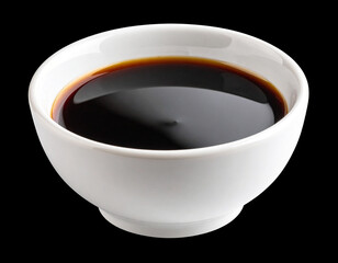 A bowl of Oyster sauce isolated on a black background